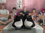 Front view of the pair showing black laces, light gray toe panels, red tongue details, and translucent outsole sections.
