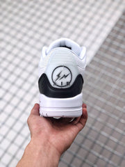 Rear view showing the black heel panel and circular ALR-style graphic detail.