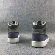 Rear view of both sneakers showing the padded collars, purple heel sections, and white soles.