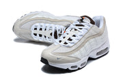 Pair of white and light gray Nike Air Max 95 TT sneakers viewed from above and at an angle.