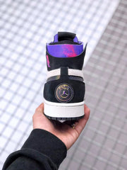 Rear view showing the black heel, circular Jordan emblem and purple padded collar.
