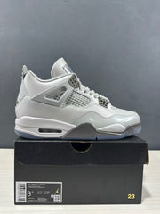Side profile of a grey Jordan Air Jordan 4 sneaker on its box; the box label shows Air Jordan 4 Retro, size EU 42 and style code HV4401 014.