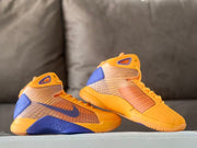 Pair of gold-yellow and purple high-top basketball shoes