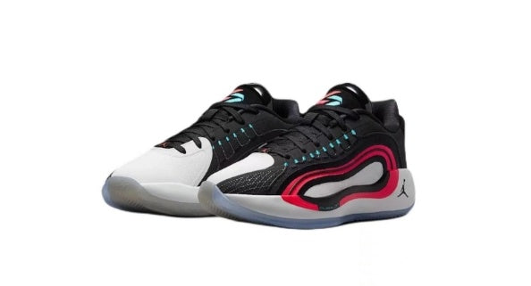 Pair of black, white, and red Jordan Luka basketball sneakers shown from the side.