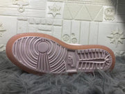 Outsole close-up showing the circular traction pattern and translucent pink edge.