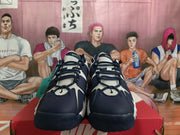 Front view of navy and white Nike sneakers with mesh tongues and lace-up closures
