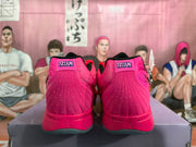 Rear view of pink basketball shoes showing padded heels and 12:AM heel labels