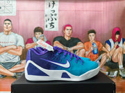 Pair of purple and teal Nike basketball sneakers shown in side view on a black shoebox.