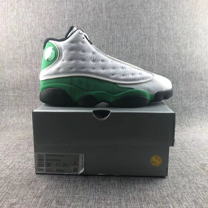 White, green, and black Jordan Air Jordan 13 sneaker displayed on its box; the box label shows a photographed sample size of US 9.5.