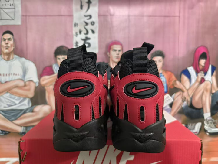 Rear view of red and black Nike sneakers with heel pull tabs