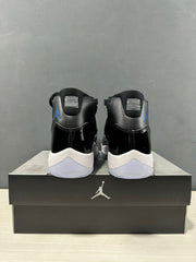 Rear view of the pair showing the black heel panels, blue side branding, and white midsoles.