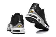 Rear and outsole views of Nike Air Max Plus VII sneakers showing silver-tone heel panels and cushioning windows.