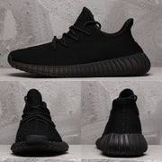 Composite view showing the side, front, and rear angles of the black sneaker.