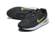 Angled top view of black Nike Air Max Verse sneakers with volt-green Swooshes and white midsoles.