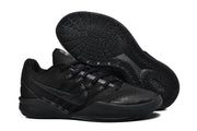 Black Nike low-top basketball shoes shown from above and below.