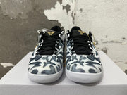 Front view of patterned black and white Nike Kobe basketball shoes with black laces