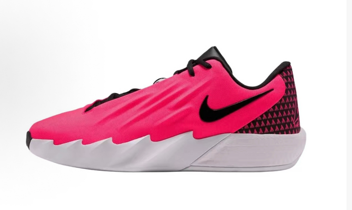 Side view of a bright pink Nike low-top sneaker with a black Swoosh, patterned heel panel, and white sole.