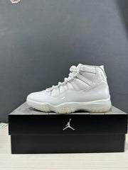 Single white high-top sneaker in side profile on a black shoebox.