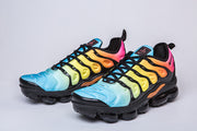 Pair of Nike Air VaporMax Plus gradient sneakers viewed from the front and side