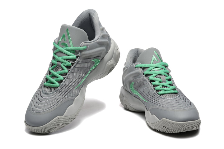 Pair of gray Nike basketball sneakers with mint-green laces, shown from front and side angles