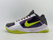 Side view of the shoe with the volt Swoosh and speckled white midsole.