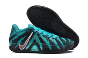 Side and outsole view showing the teal upper, contrasting swoosh, ZoomX marking and patterned black sole.