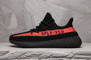 Side profile of a black sneaker with a bright red stripe and SPLV-350 text.