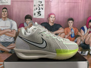 Side profile of a gray-green Nike sneaker showing the black Swoosh, stitched upper panels, and translucent-looking forefoot outsole.