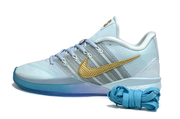 Profile of an icy blue Nike Sabrina 3 shoe with gold-colored side detail