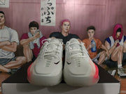 Front view of the pair showing white toe boxes, laces, black Swoosh details, and peach-pink accents.