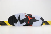 Bottom view of the sneaker showing the black and translucent outsole pattern with a bright infrared Jordan emblem.