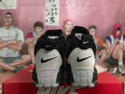 Rear view showing white heel panels, black Nike branding, and textured white outsole sections.