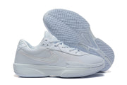 White basketball shoes shown side-on with one shoe turned over to display the patterned outsole.
