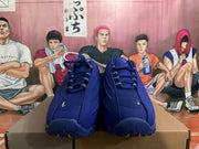 Front view of blue lace-up sneakers with patterned laces and silver-tone details.