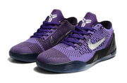 Pair of purple low-top shoes shown from the front.
