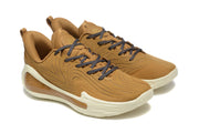 Pair of brown low-top sneakers shown from an angled front view with dark contrast laces.