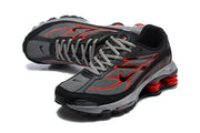 Angled top and side view of black, grey, and red Nike Shox Ride 2 sneakers.
