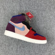 Side profile showing the multicolor high-top sneaker, light blue side logo, black laces, and furry collar detail.