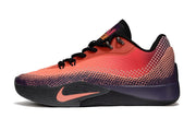 Side view of coral and dark purple Nike S.T. Flare EP basketball shoes with a dotted gradient pattern.