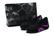 Black and purple shoes pictured beside a coordinating box
