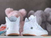 Rear view of the shoes showing heel details and black side logos