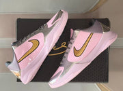 Angled overhead view of the pair arranged over a black shoebox.