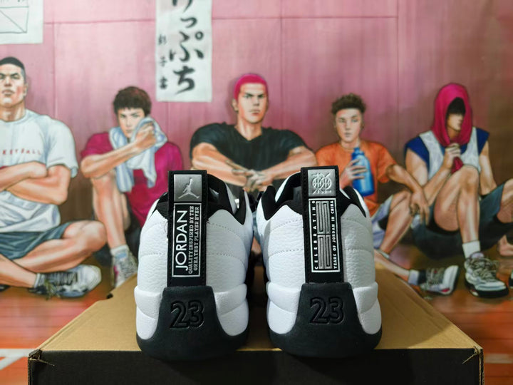 Rear view of white and black Jordan sneakers showing heel tabs and molded heel details