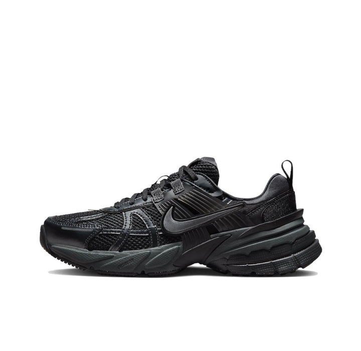 Side view of a black Nike lace-up sneaker with layered side detailing and a chunky sculpted sole.