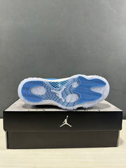 Outsole view showing the translucent sole with blue herringbone traction sections and a visible central Jumpman detail.