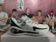 Side view of a white and black Wade basketball shoe with a visible sole window