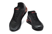 Front and top views of black Nike Air Max 720 sneakers with red tongue details.