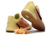 Yellow and orange Nike Sabrina 3 shoes shown from the heel and outsole