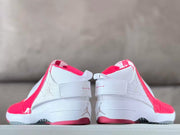 Rear view of both sneakers showing heel branding, ankle straps, and red outsole accents.