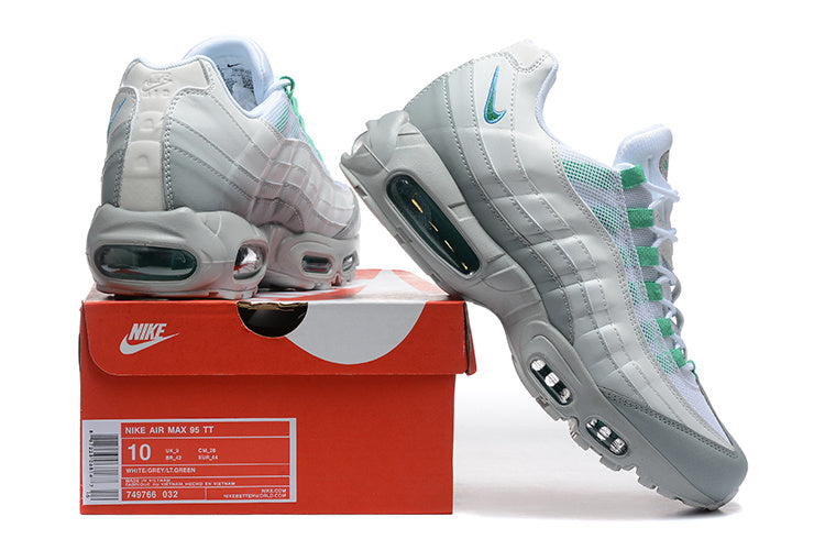 Nike Air Max 95 TT sneakers in white, grey, and green displayed with a shoe box labeled size 10
